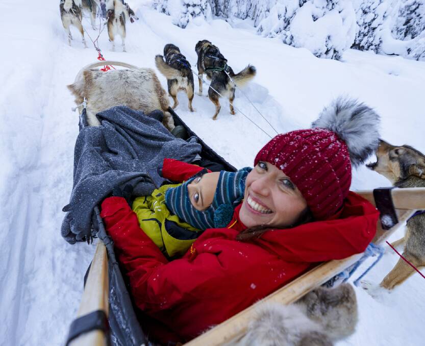 All smiles on a sled ride in Lapland, Finland. Picture: Getty Images