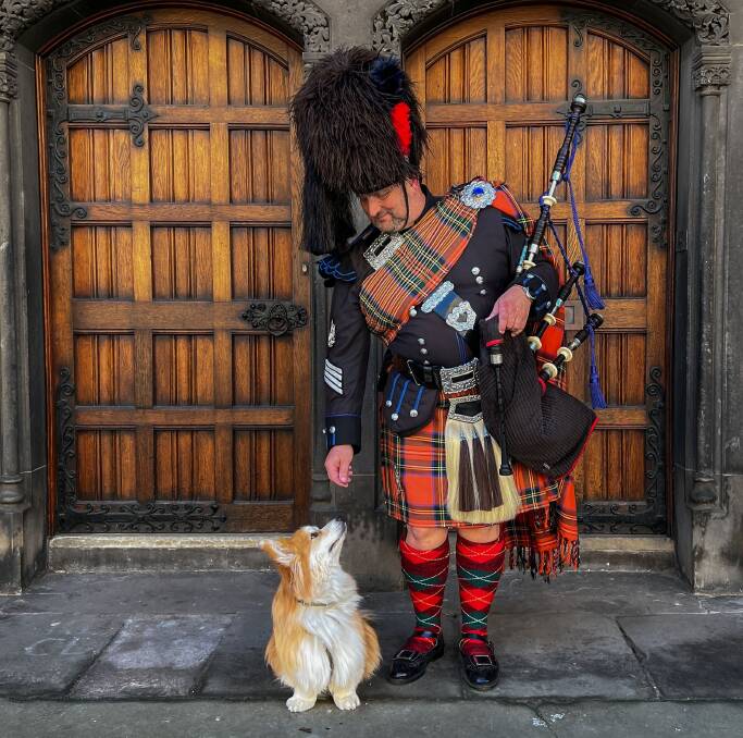 A bagpiper and friend in Edinburgh.