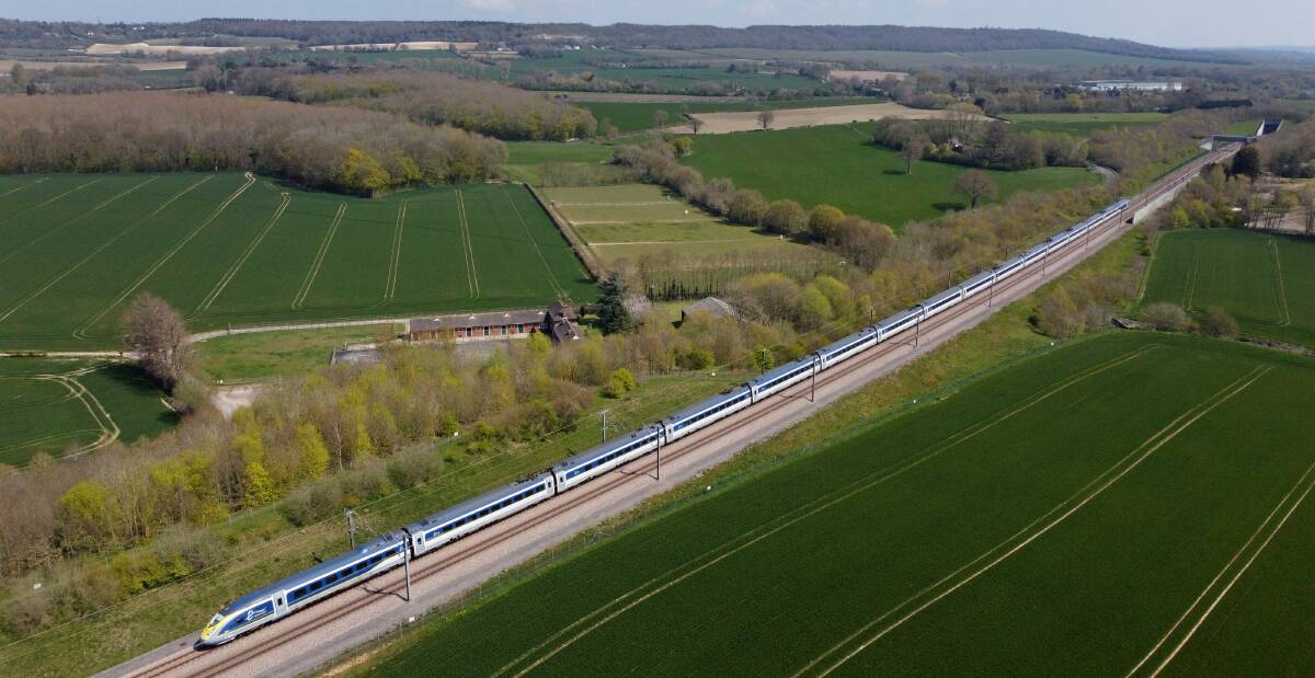 A Eurostar train passes through the Kent countryside.