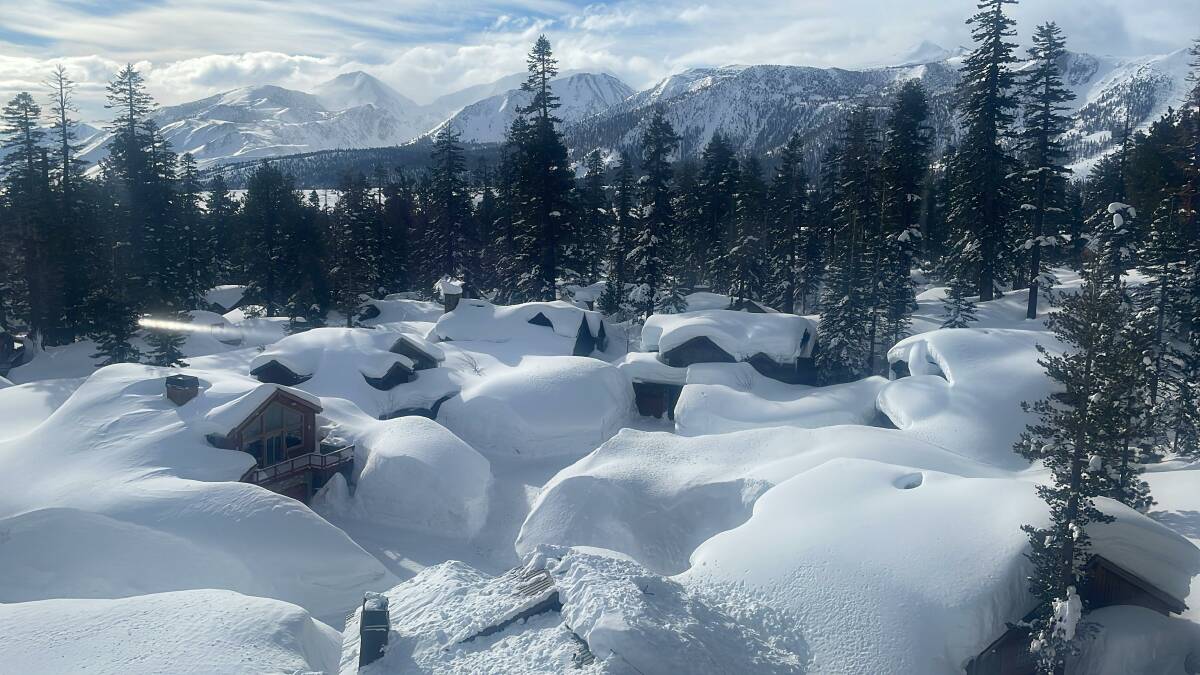 Unattended holiday homes disappear under the snow at the top of the village at Mammoth Mountain. Picture: Scott Hannaford