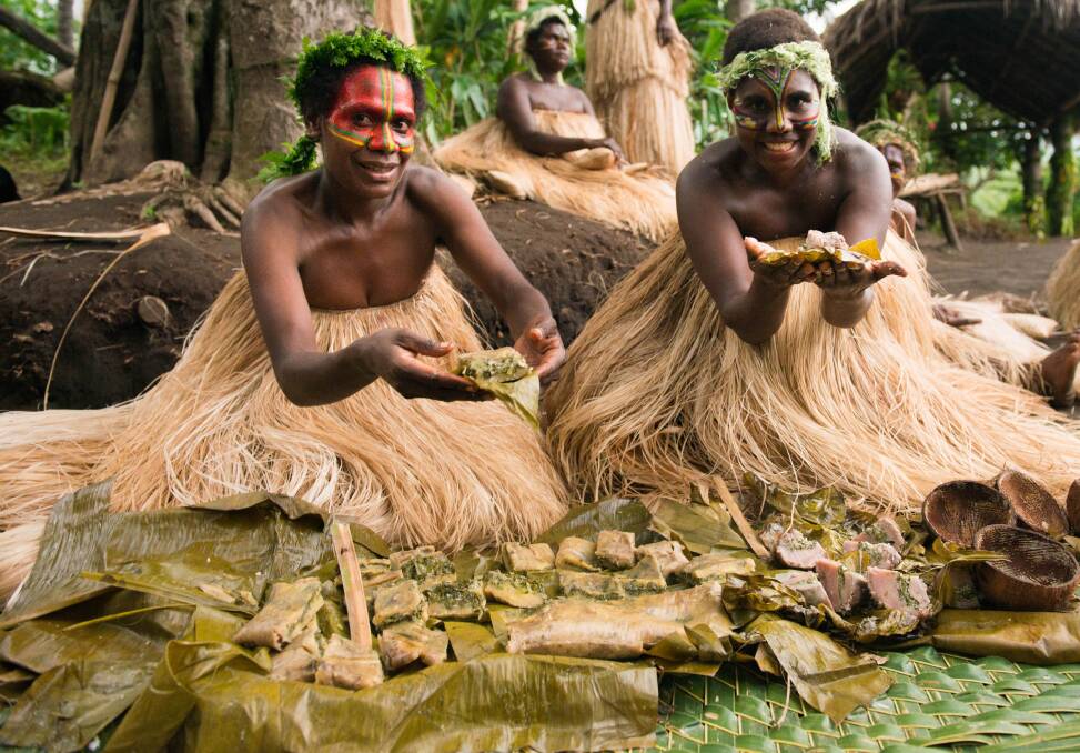 Women serving laplap in Vanuatu.