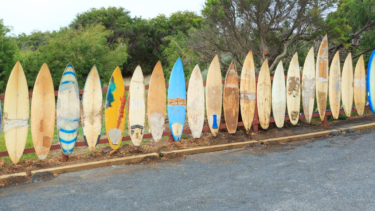 Vintage surfboards make a fence at Prevelly, WA. Picture: Getty Images