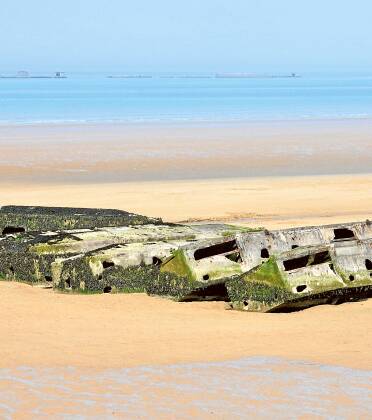 Mulberry harbours on the beach at Arromanches. Picture: Shutterstock
