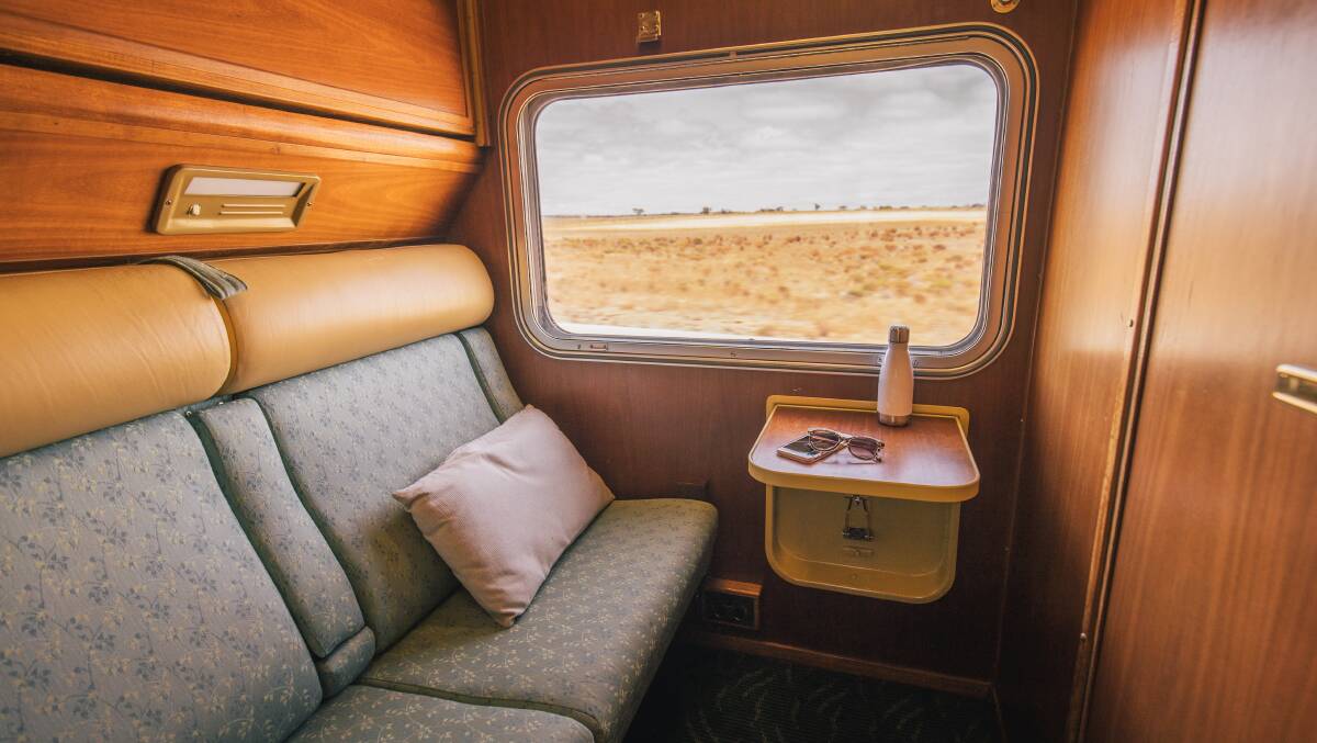Day setup of a gold twin cabin on The Ghan. 
