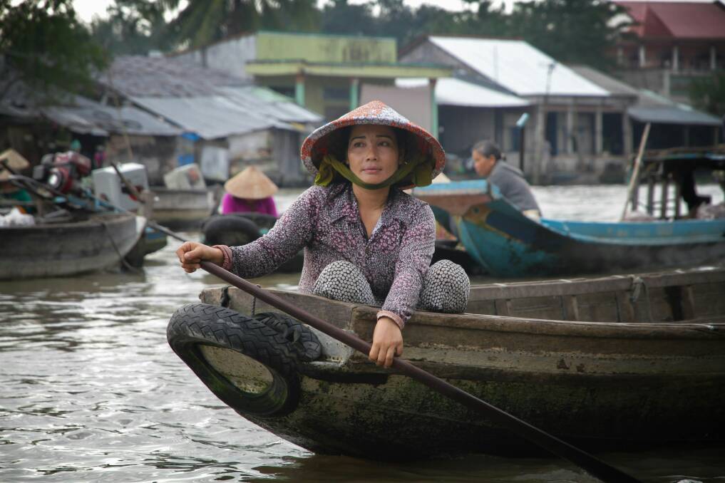 See floating markets in Vietnam as part of a Mekong cruise.