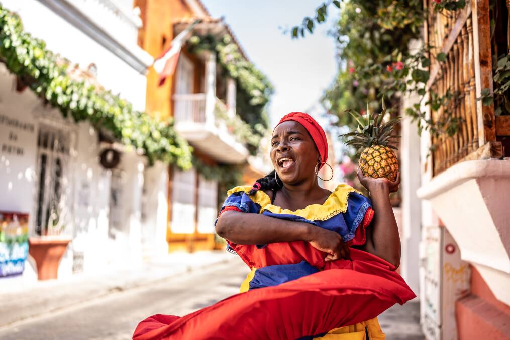 A Palenquera walking through the streets of Cartagena. Picture: Getty Images