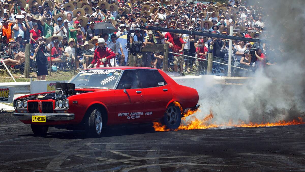 A car performs in the burnout competition at the Street Machine Summernats festival in Canberra. Picture: Getty Images