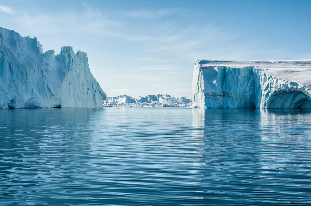 Explore the Jakobshavn Glacier in Greenland as part of Aurora Expeditions' helicopter tour.
