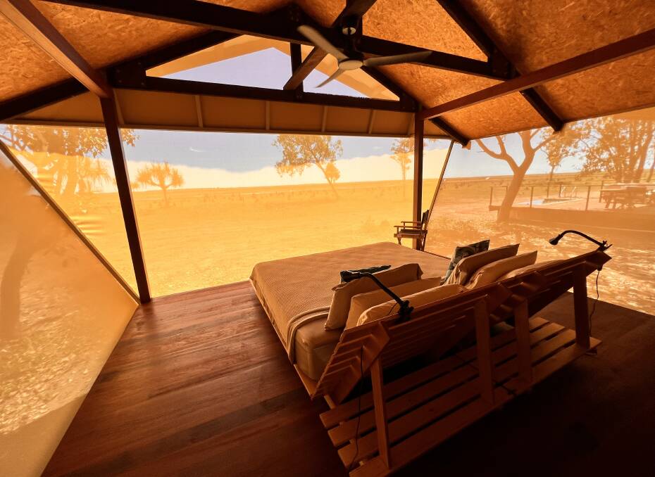 The king-sized bed in the Jabiru Retreat bungalow is the perfect place to watch the sunrise. Picture: John Hanscombe