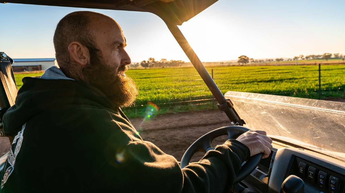 Pete Gerber at Pioneer Brewing near Orange, NSW, drives past the barley he grows on the brewery’s farm.