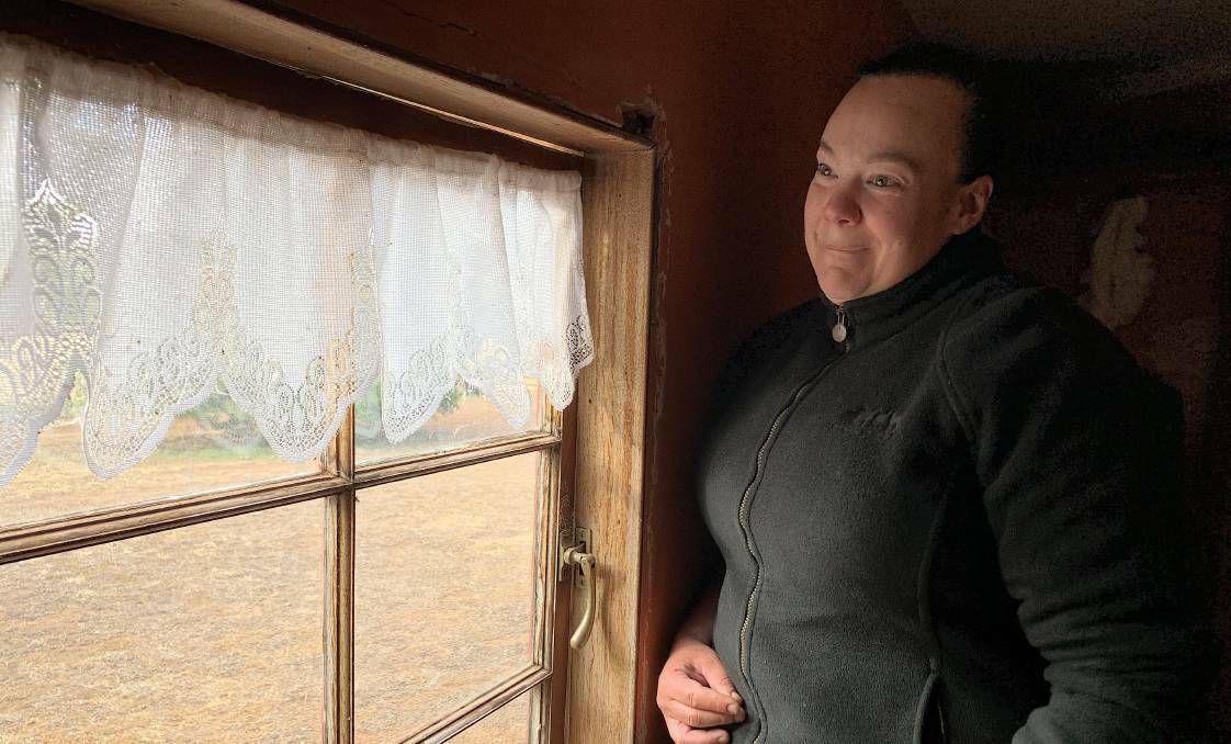 Lizzie McIntosh at the window where she saw a ghost at Cooma Cottage. Picture: Tim the Yowie Man