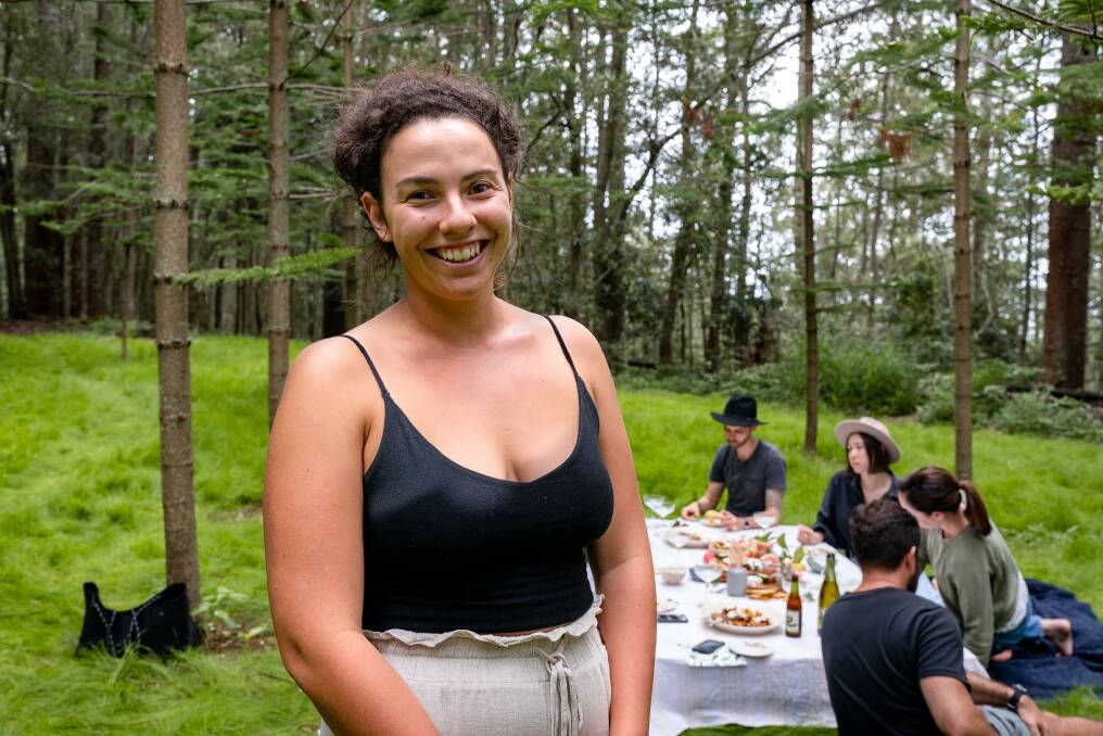 Paige Christian Adams in front of one of her picnic spreads she provides with Platters by Paige.