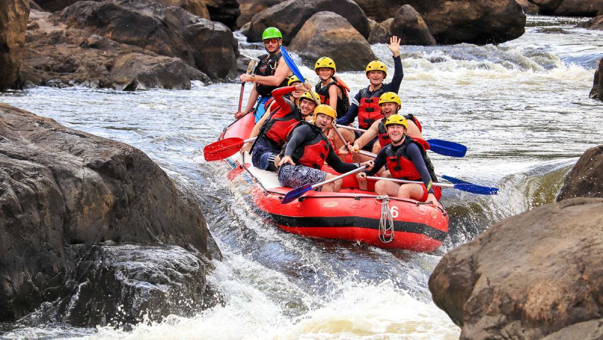 More excitement for Michael (middle right) as he rafts through the rapids at Barron River. Picture- Cairns Adventure Group