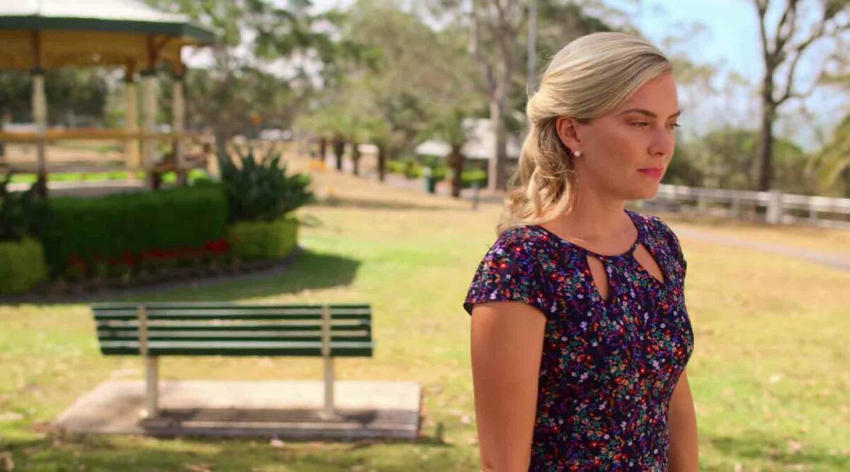 Caroline Wilson played by Cindy Busby standing in Moora park with the rotunda in the background in the film.