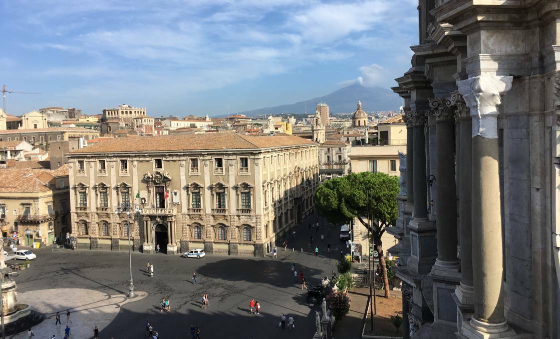 Catania’s Piazza del Duomo with Mt. Etna in the background.