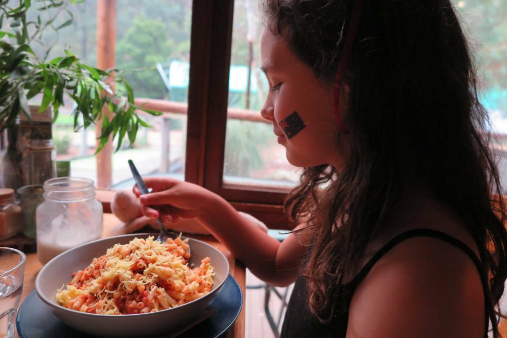Linda’s daughter Angeline enjoys vegan pasta at Secret Creek Cafe.